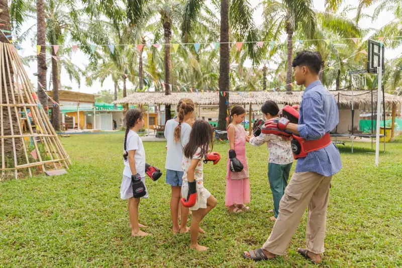 A group Muay Thai lesson on the lawn
